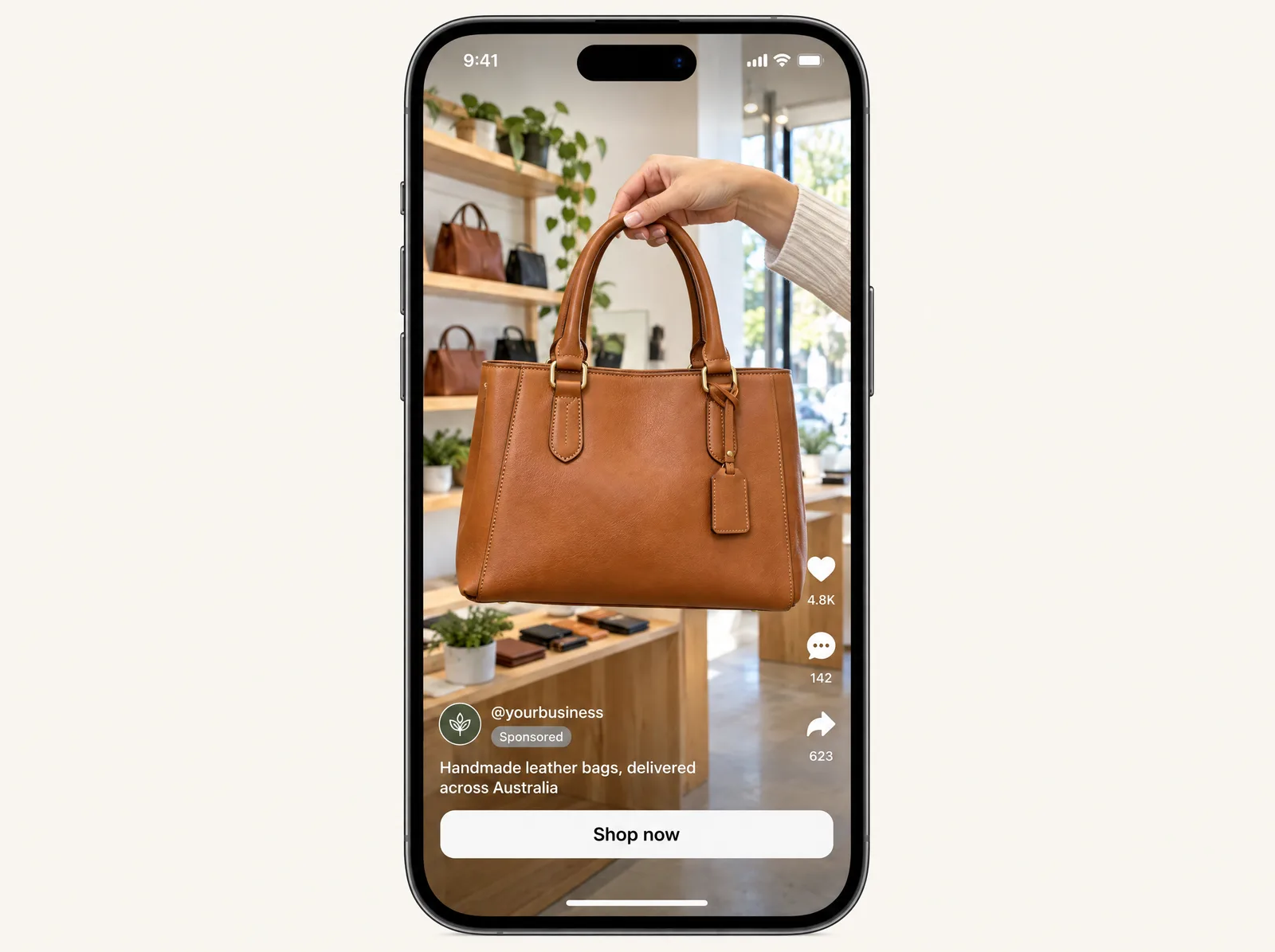 A phone showing a full-screen vertical video ad for a leather handbag with a Shop now button
